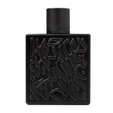 Black perfume bottle with intricate design on a white background
