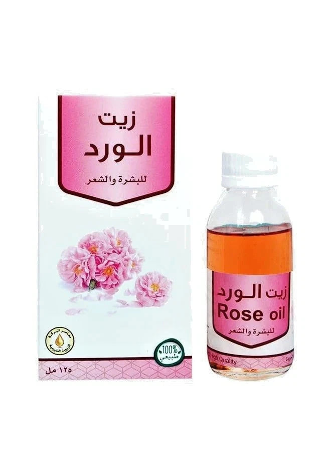 Rose oil bottle and packaging with Arabic text on a white background