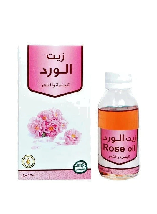 Rose oil bottle and packaging with Arabic text on a white background
