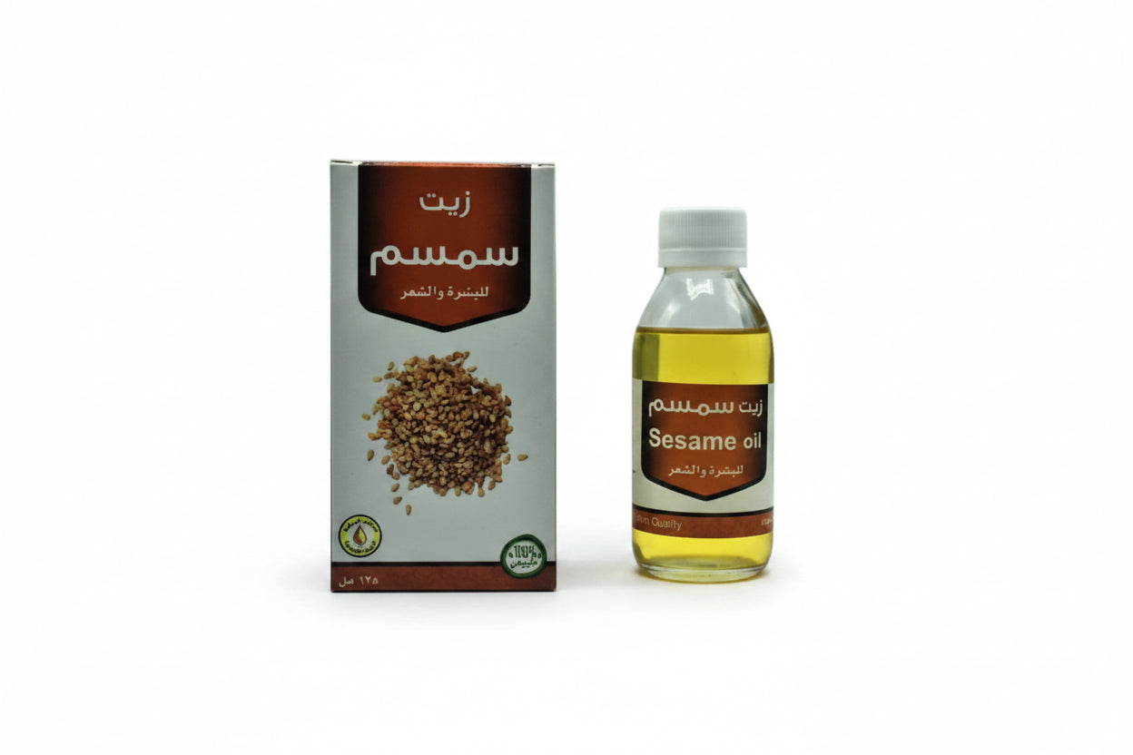 Sesame oil bottle and packaging on a white background