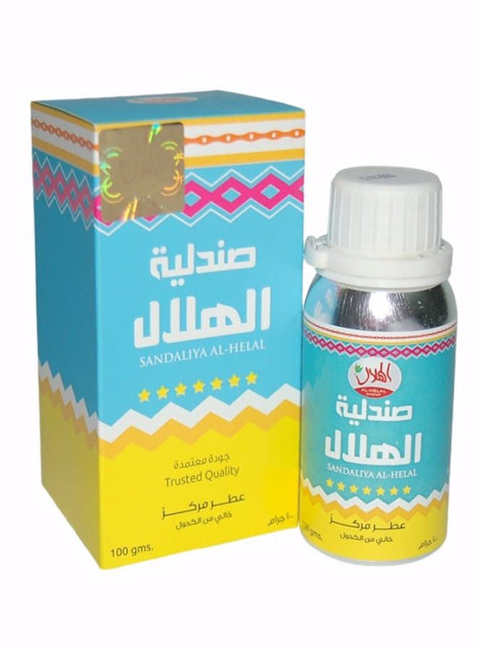 A bottle and packaging box of Sandaliya Al-Helal Handmade Holy Melt, featuring a turquoise and yellow design with Arabic text and a white cap.