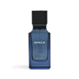A rectangular blue glass perfume bottle with a black textured cap, featuring the brand name 'SERIOUS' and 'EAU DE PARFUM' printed on the front, set against a plain white background.Serious – Amber Fougère EDP 100ml – Al Majed Oud