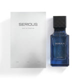 A bottle of Serious Eau de Parfum next to its white packaging box, set against a clean white background.Serious – Amber Fougère EDP 100ml – Al Majed Oud