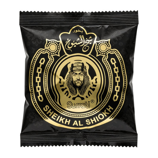 A sealed black snack pouch with a large gold circular emblem featuring a portrait and the text 'Sheikh Al Shiek' and 'Surati', photographed on a plain white background.Sheikh Al Shiokh Choco Bakhoor 40g – Surrati