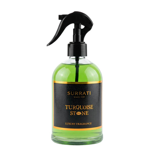 Green spray bottle with black nozzle labeled 'Surrati Turquoise Stone' on a white background