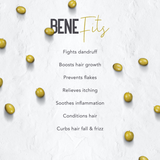 A text-based benefits graphic on a light textured background with scattered olive-like seeds. The headline reads 'BENEFits' in dark gray and gold, followed by a list of hair-care claims: fights dandruff, boosts hair growth, prevents flakes, relieves itching, soothes inflammation, conditions hair, and curbs hair fall & frizz.