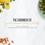 A styled flat-lay graphic with text reading 'THE GOODNESS OF sweet almond, lemon, & olives' over a white textured background, surrounded by lemons, almonds, olives, and a plate of olives.