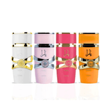 Four perfume bottles from the Al Khalifa collection lined up on a reflective white surface. The bottles are white with gold trim, light pink with a silver bow, bright pink with a gold bow, and orange with a gold bow. Yara Collection 4-Piece Gift Set – 25ml EDP | Lattafa Perfumes
