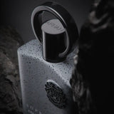 A sleek white speckled afnan supremacy collectors perfume bottle with black cap and silver ring from fragrance houses precious woods