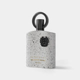 White speckled afnan supremacy collectors edition perfume bottle with black ring cap and embossed crest by afnan