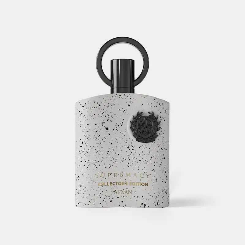 A sleek white speckled afnan supremacy collector’s perfume bottle with black cap featuring gold lettering and crest