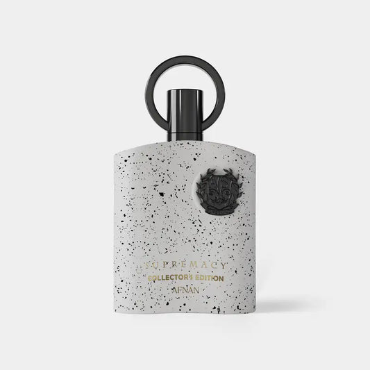 A sleek white speckled afnan supremacy collector’s perfume bottle with black cap featuring gold lettering and crest