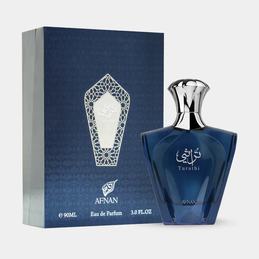 Deep blue glass turathi blue 90ml eau de parfum for men with silver cap and arabic script next to matching box