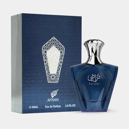 Deep blue glass turathi blue 90ml eau de parfum for men with silver cap and arabic script next to matching box