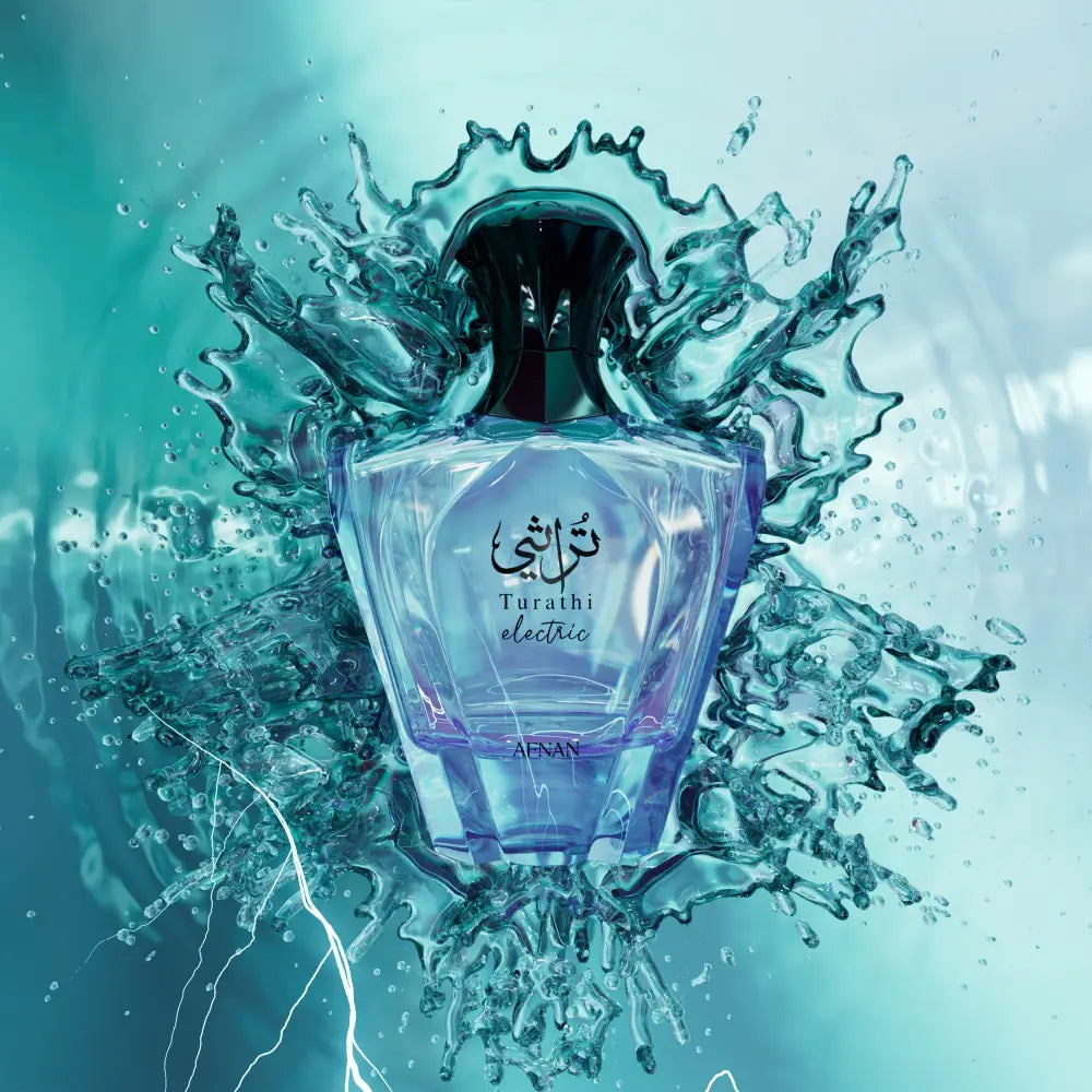 Afnan turathi electric 90ml eau de parfum in a sleek transparent glass bottle with black cap and embossed arabic script