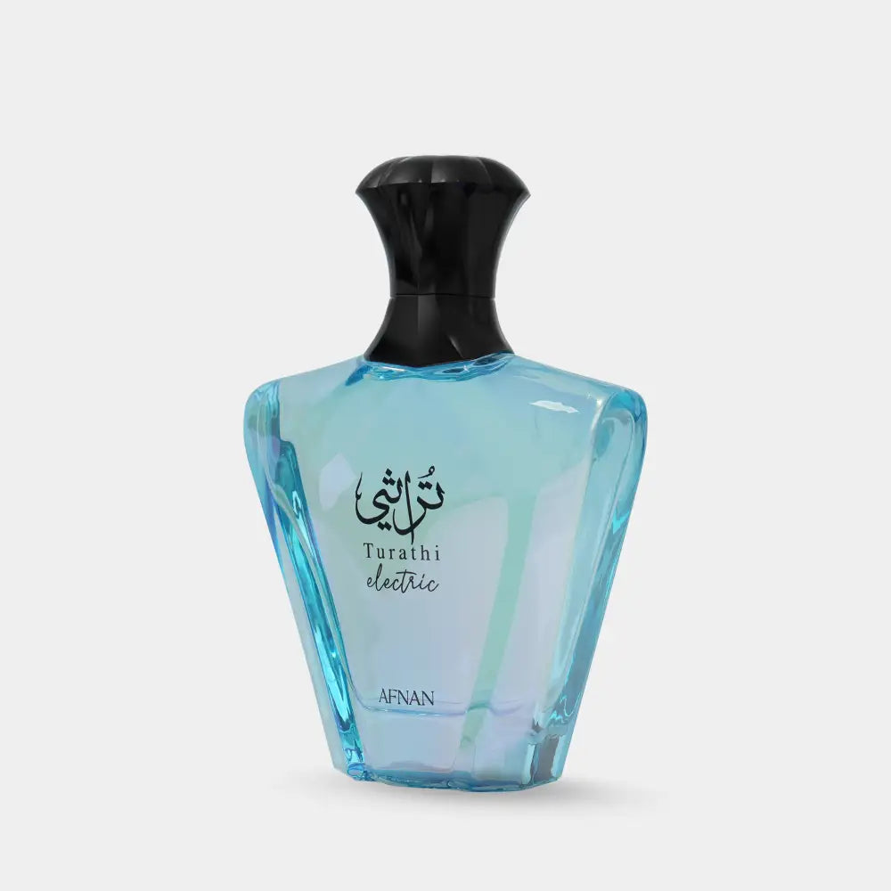 A translucent light blue glass perfume bottle with black cap and arabic script for afnan turathi electric signature scent