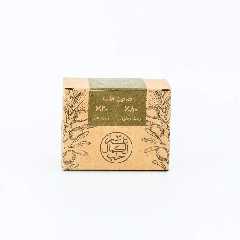 Bar of soap in a cardboard box with olive design on a white background