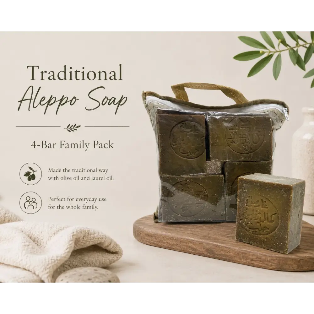 Traditional Aleppo Soap 4-Bar Family Pack on a wooden tray with olive branches and towels.