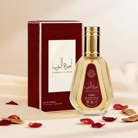 Perfume bottle and packaging with gold and red design on a white background