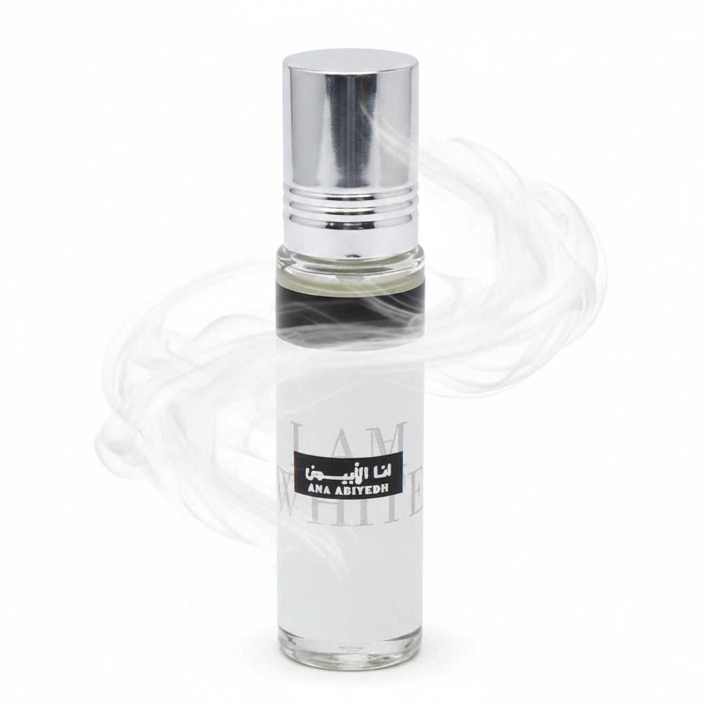 Clear glass perfume bottle with a black label on a white background