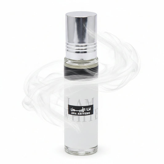 Clear glass perfume bottle with a black label on a white background