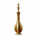 Gold-colored decorative object with a spout on a white background