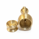 Two brass containers on a white background