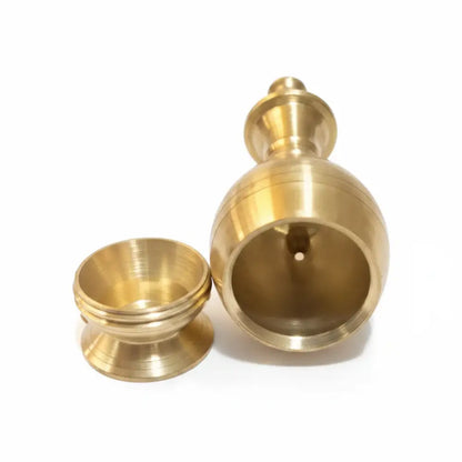 Two brass containers on a white background