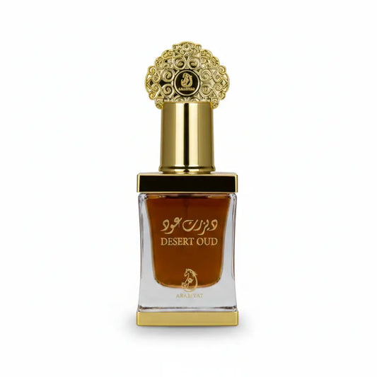 Desert Oud perfume bottle with gold cap and Arabic text on a white background