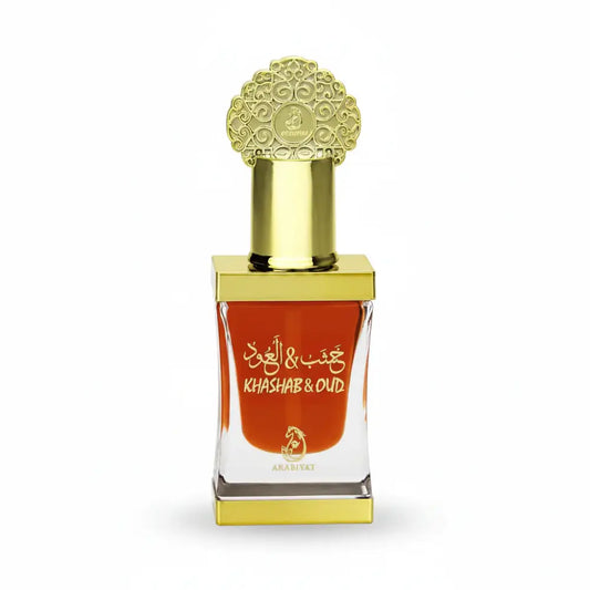Perfume bottle with gold cap and clear glass body on a white background