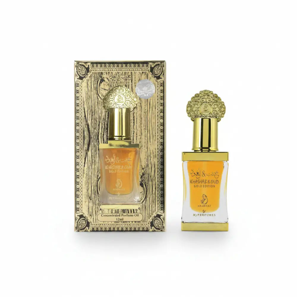 Perfume bottle with gold cap and packaging on a white background