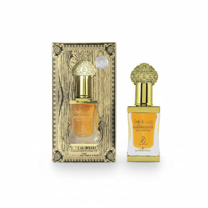 Perfume bottle with gold cap and packaging on a white background