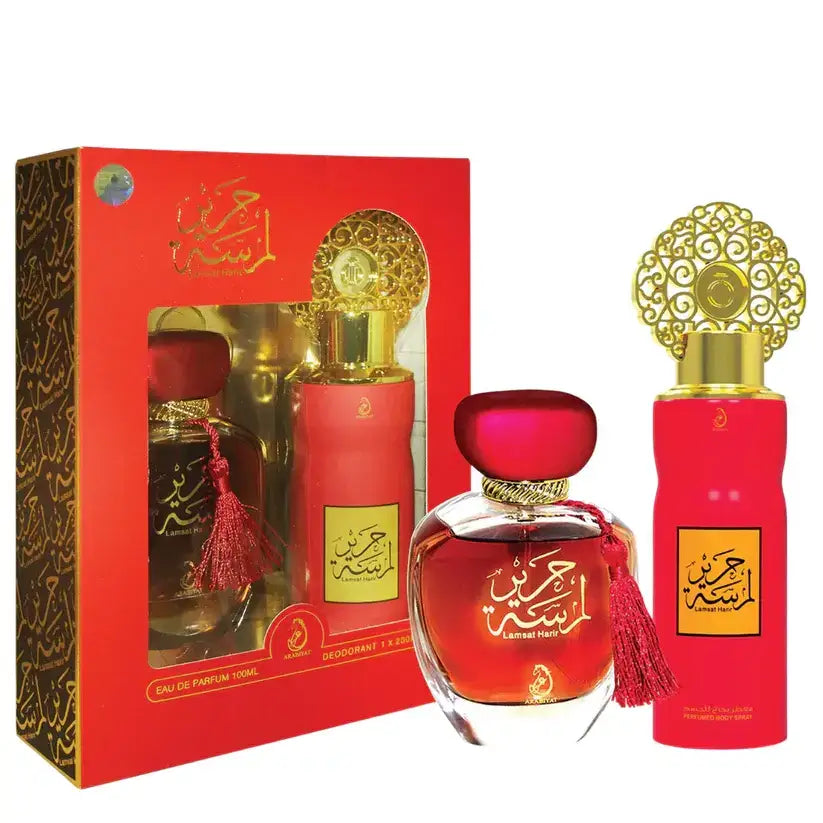 Red glass perfume bottle with gold accents and tassel from arabiyat lamsat harir edp 100ml gift set