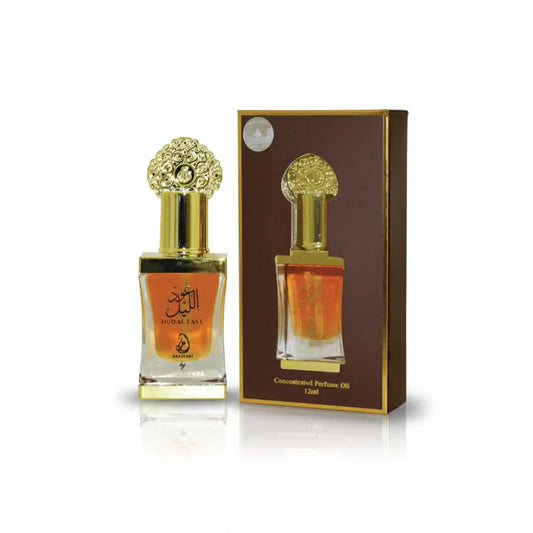Perfume bottle with gold cap and packaging on a white background