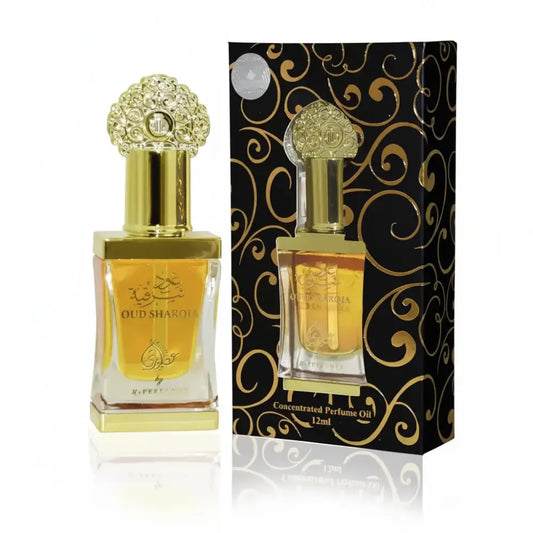 Perfume bottle with gold cap and packaging featuring intricate designs on a white background