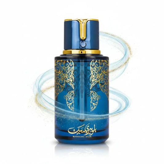 Deep blue glass arabiyat prestige perfume bottle with gold filigree cap labeled botancane ahlun blueberry musk 100ml