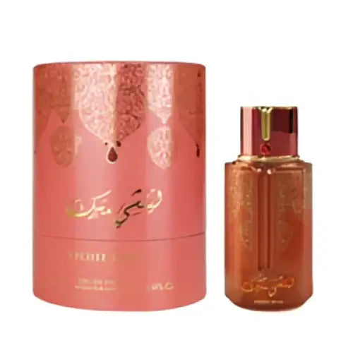 Luxurious amber arabiyat prestige lychee musk perfume bottle with gold detailing and matching cylindrical packaging displayed