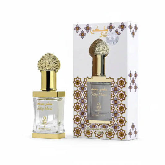 Perfume bottle with gold cap and decorative packaging on a white background
