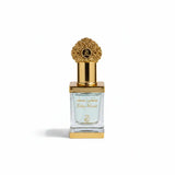 Perfume bottle with decorative cap on a white satin background