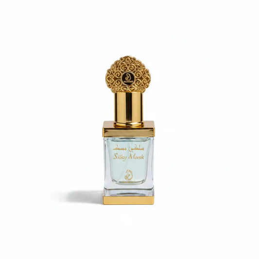 Perfume bottle with decorative cap on a white satin background