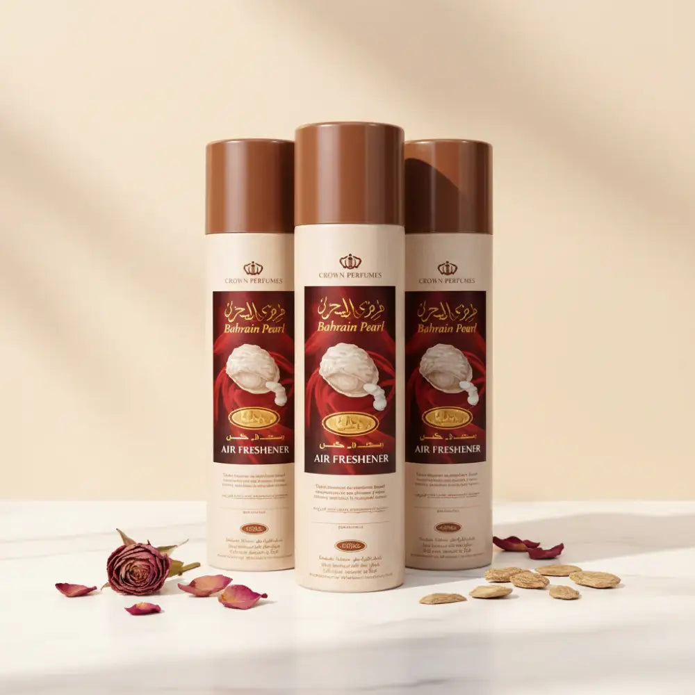 Three beige and brown crown perfumes bahrain pearl air freshener cans with red and gold labels by rehab perfumes