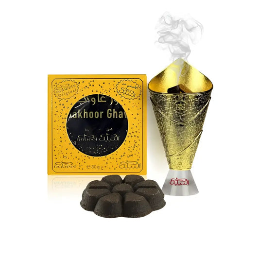 Golden conical incense burner with intricate embossed patterns and silver base emitting smoke from nabeel bakhoor bakhoor ghawi arabian oud
