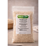 A clear plastic bag of light beige premium quality pearl barley 500g labeled banadir one natural grains