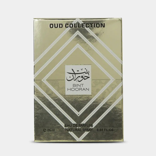Gold-colored rectangular bint hooran pocket spray with white geometric patterns and black arabic oud floral label