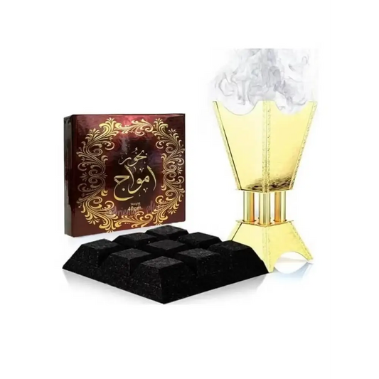 Golden incense burner with fluted tiered design and smoke rising for bukhoor amwaj by ard al zaafaran noor east