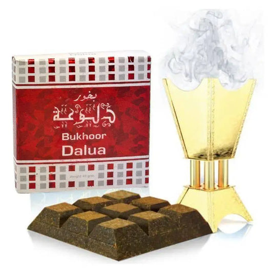 Golden incense burner with smoke rising beside bukhoor dalua 40g box and dark brown incense by ard al zaafaran noor east