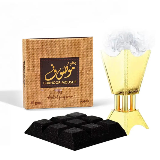 Golden incense burner with fluted tapered design and wide base for bukhoor mousuf by ard al zaafaran noor east