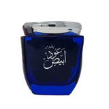 Blue perfume bottle with silver cap on a white background