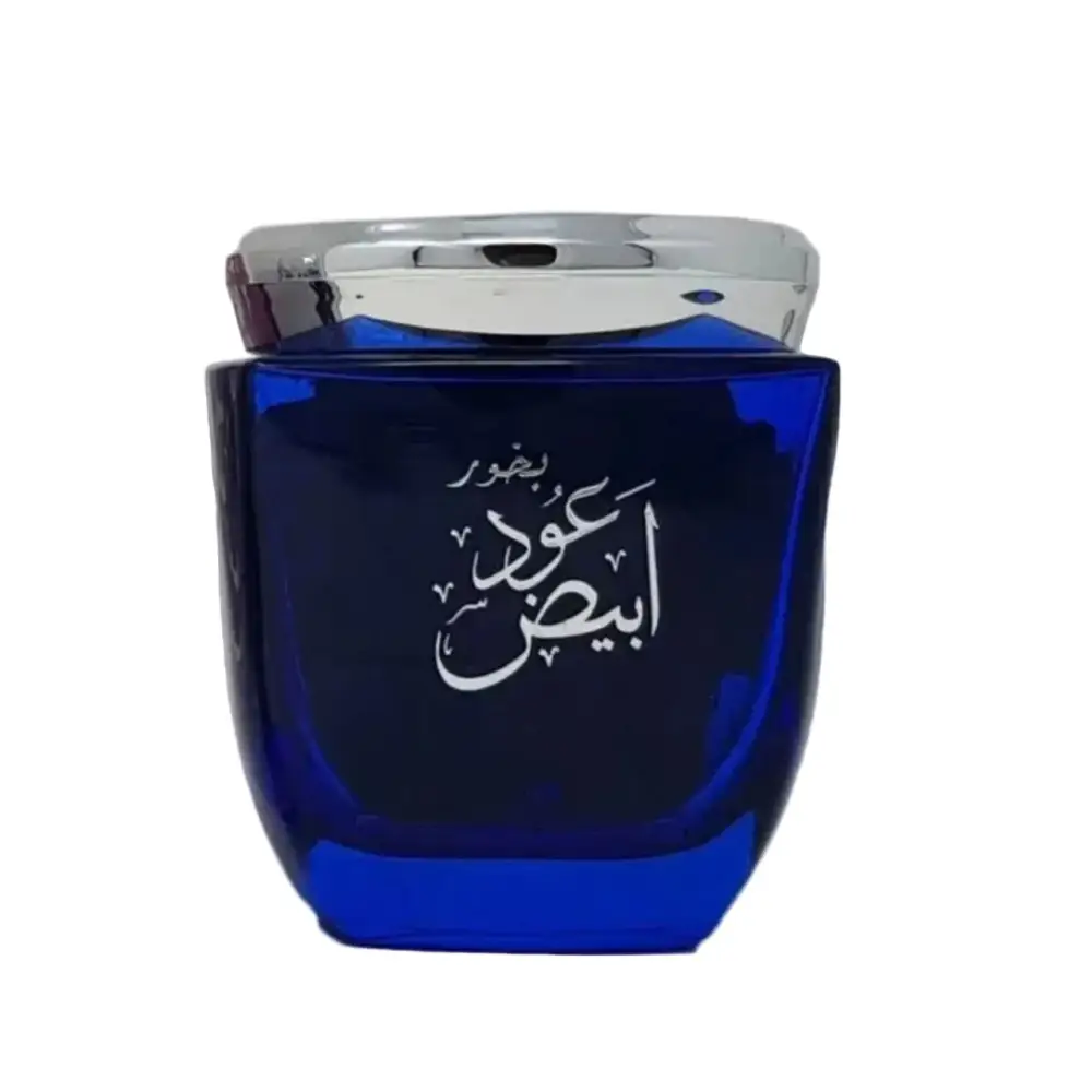Blue perfume bottle with silver cap on a white background