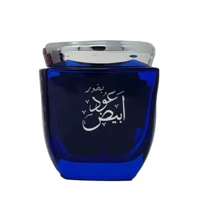 Blue perfume bottle with silver cap on a white background
